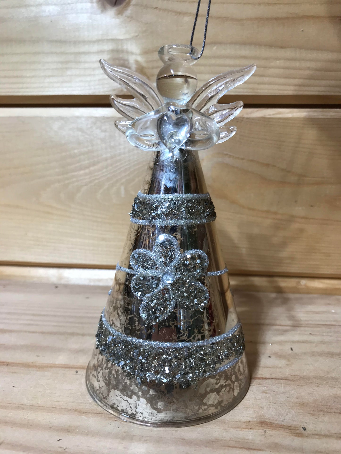 This stunning glass antique effect angel holding a heart, decorated with beading in a floral design, will be the perfect finishing touch to your Christmas tree!