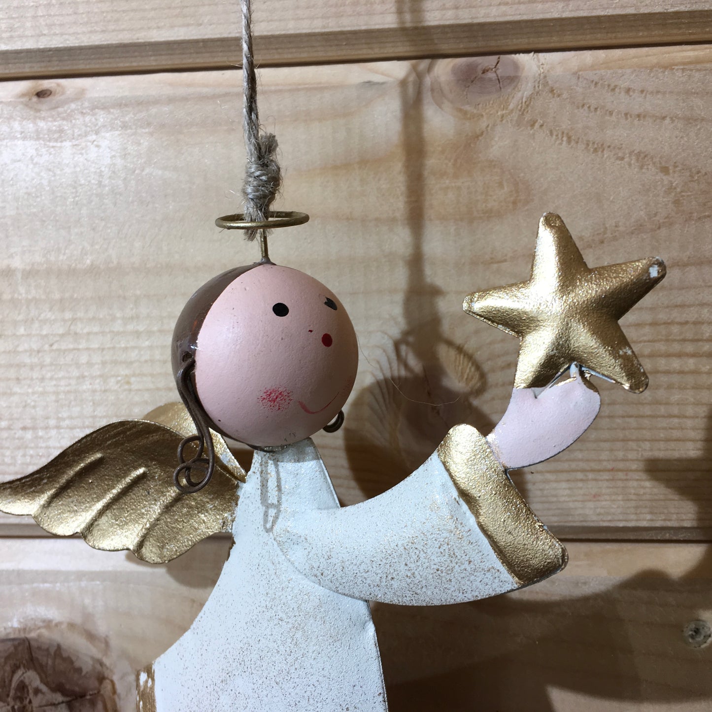 Large hanging angel holding a golden star Christmas tree  decoration