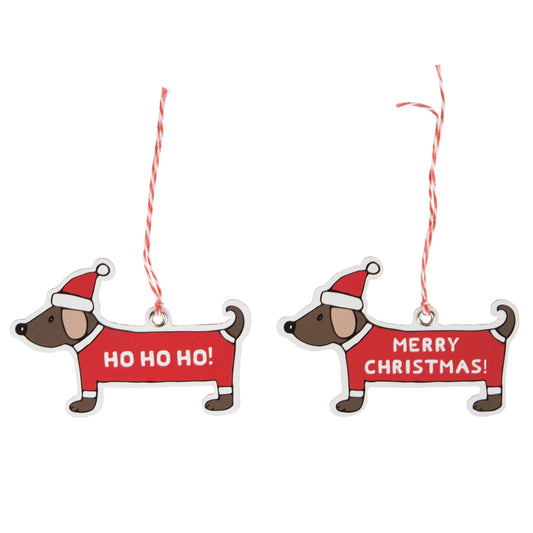 Pack of 12 gift tags featuring very cute daschunds wearing Christmas hats and coats with 'Ho Ho Ho' and 'Merry Christmas' written on them with red and white string.