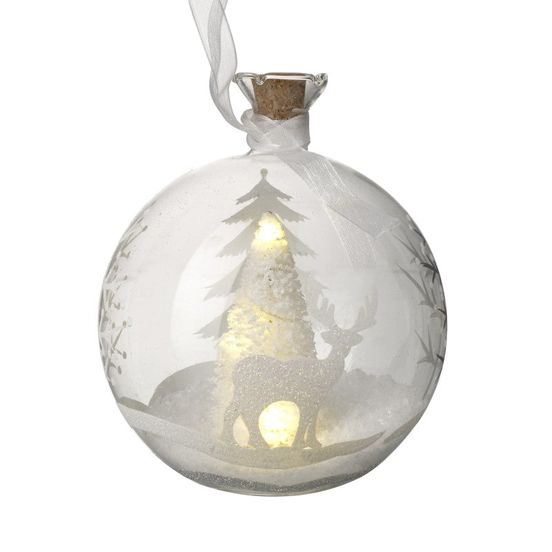 Allow yourself to dream with this gorgeous stags in snow scened LED light up glass Christmas tree decoration: featuring wooden stags and trees in snow!