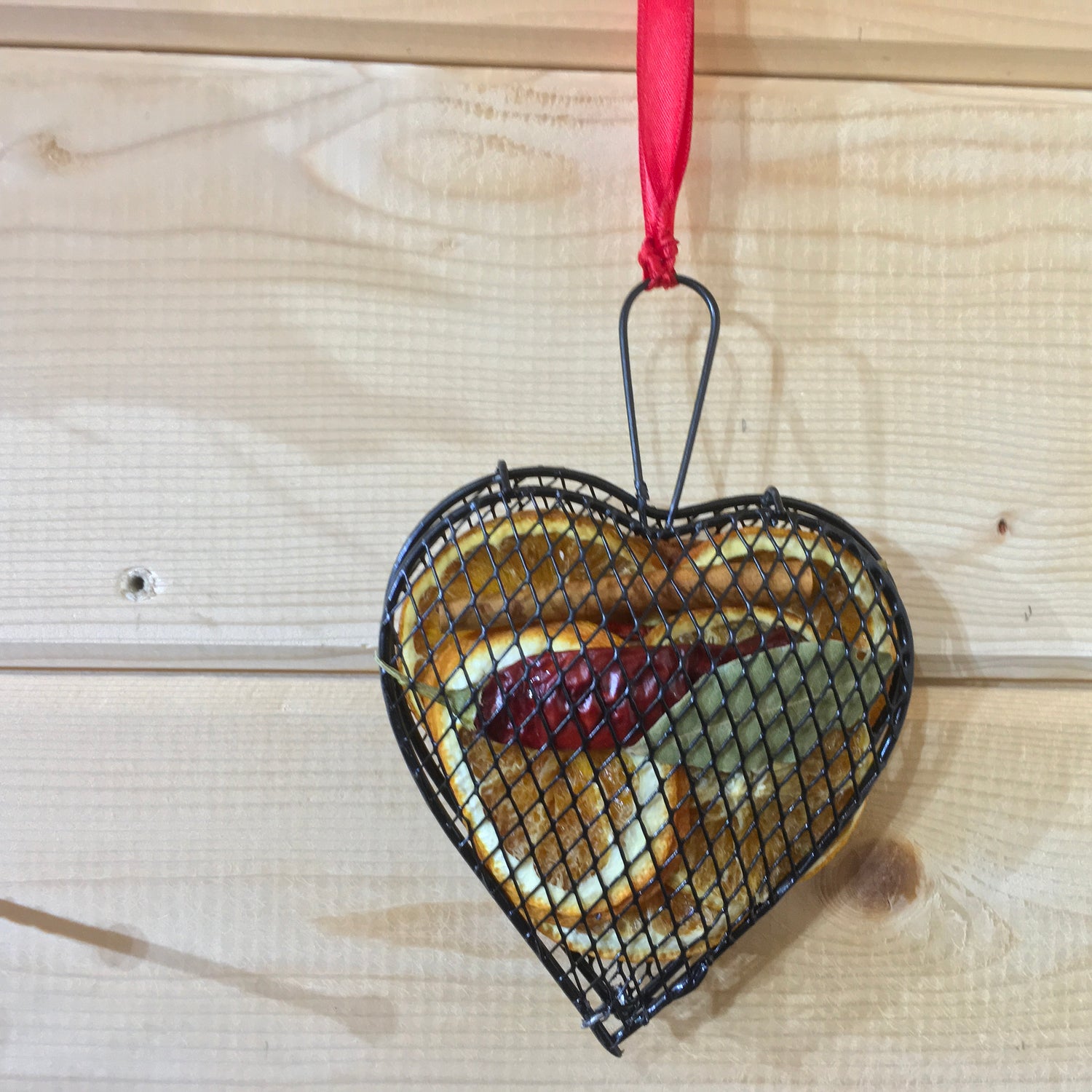 Dried Christmas heart of orange slices, cinnamon & chili to make your house smell festive.