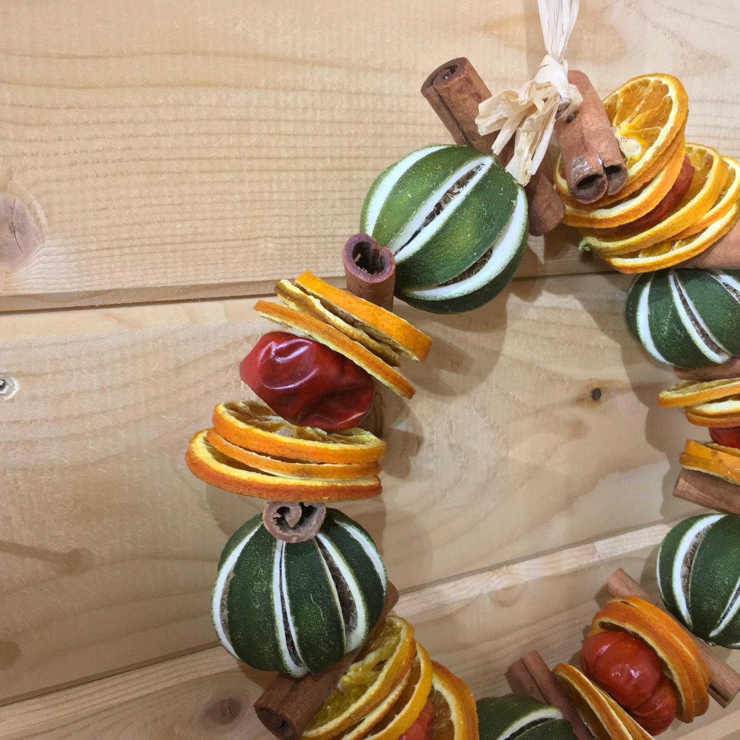 Green Limes with Cinnamon Sticks and Orange Slices Circle
