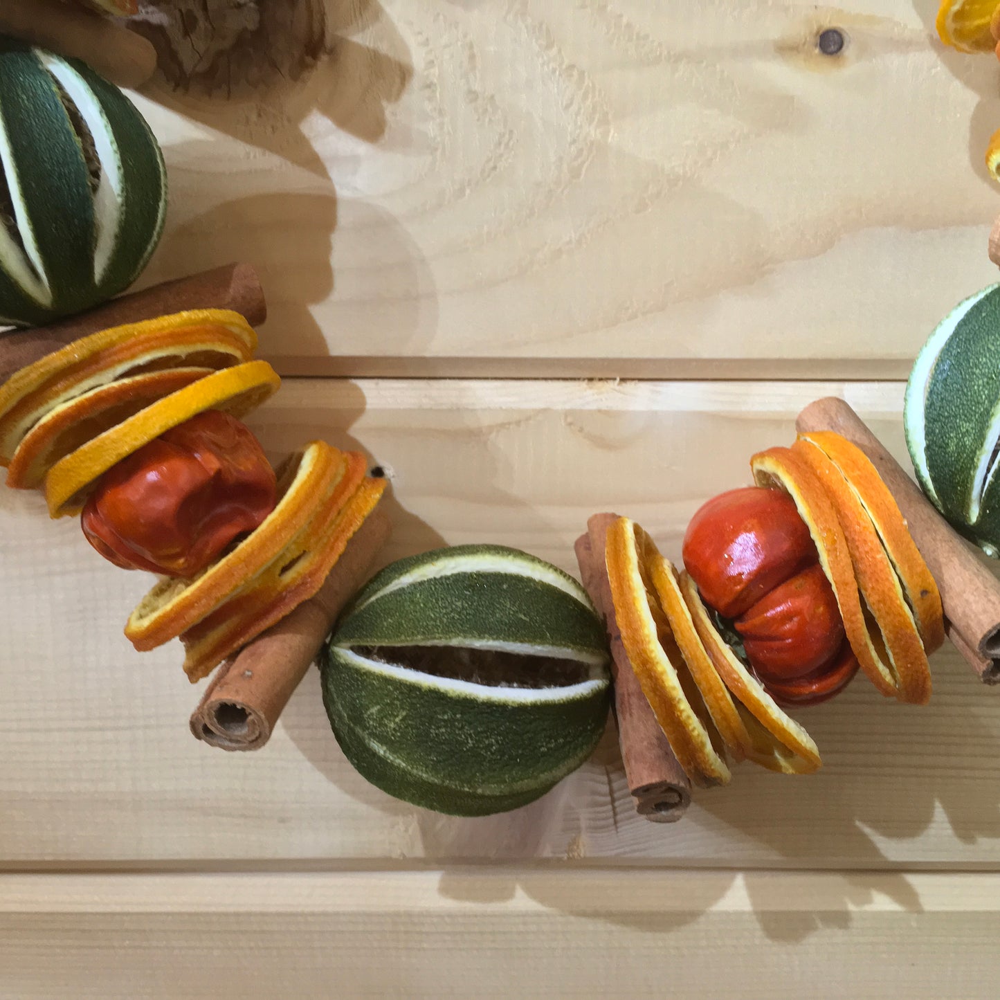 Green Limes with Cinnamon Sticks and Orange Slices Circle