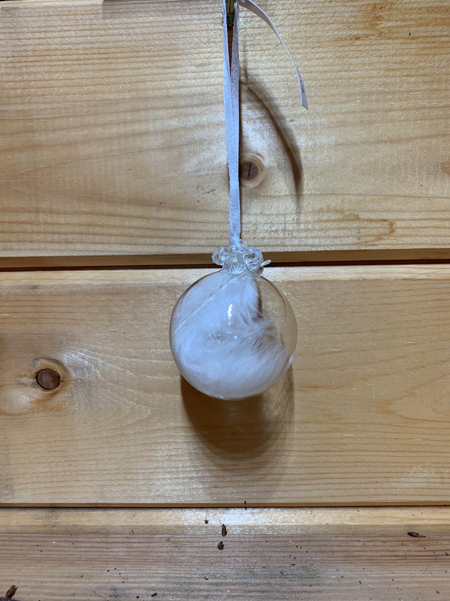 Lovely clear round bauble shaped glass hanging Christmas decoration with a white feather inside and delicate beading on the top.
