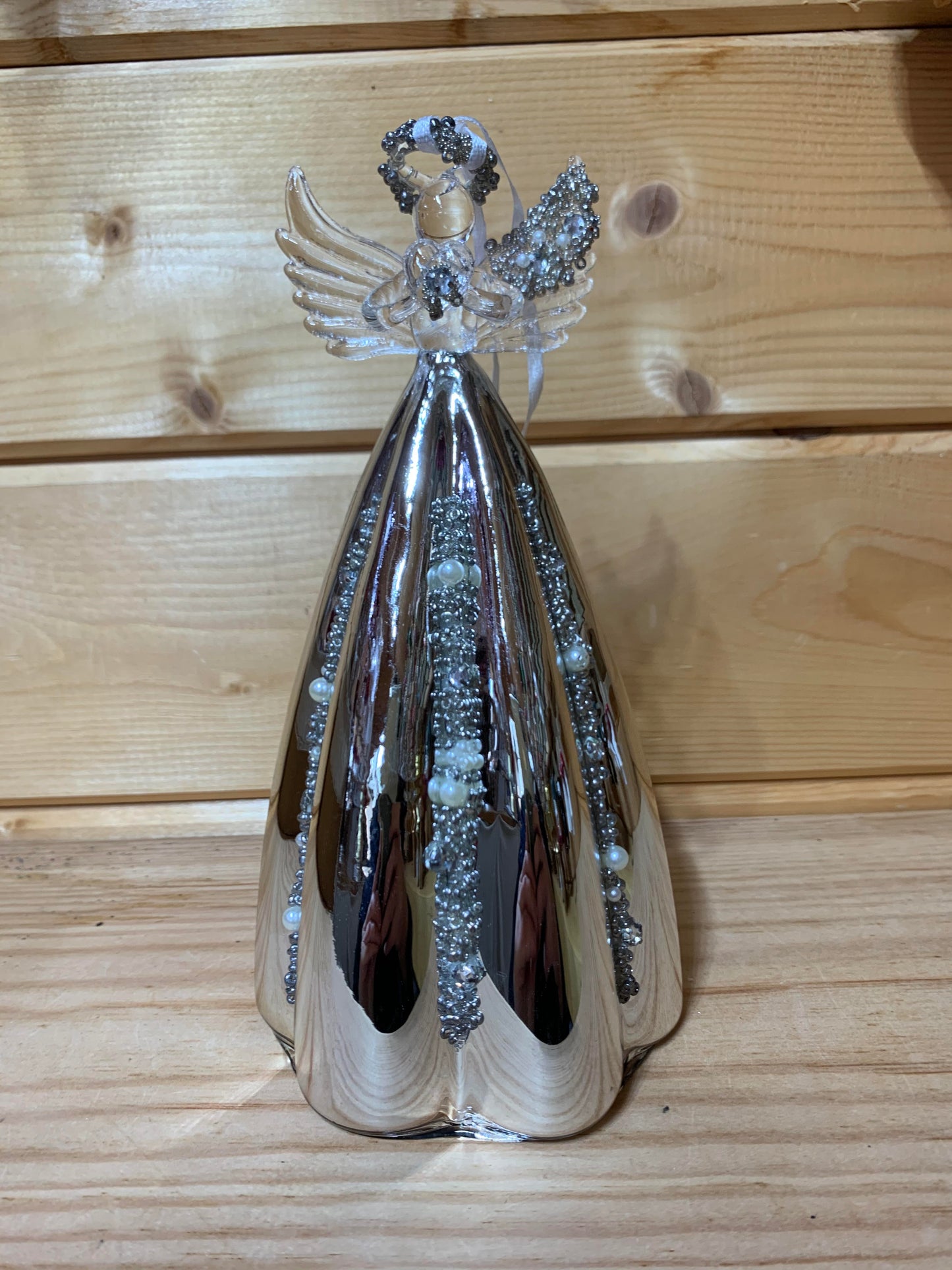 This stunning 19cm glass angel has delicate beading on the halo, wing and also on the silver mirrored skirt which is fluted.