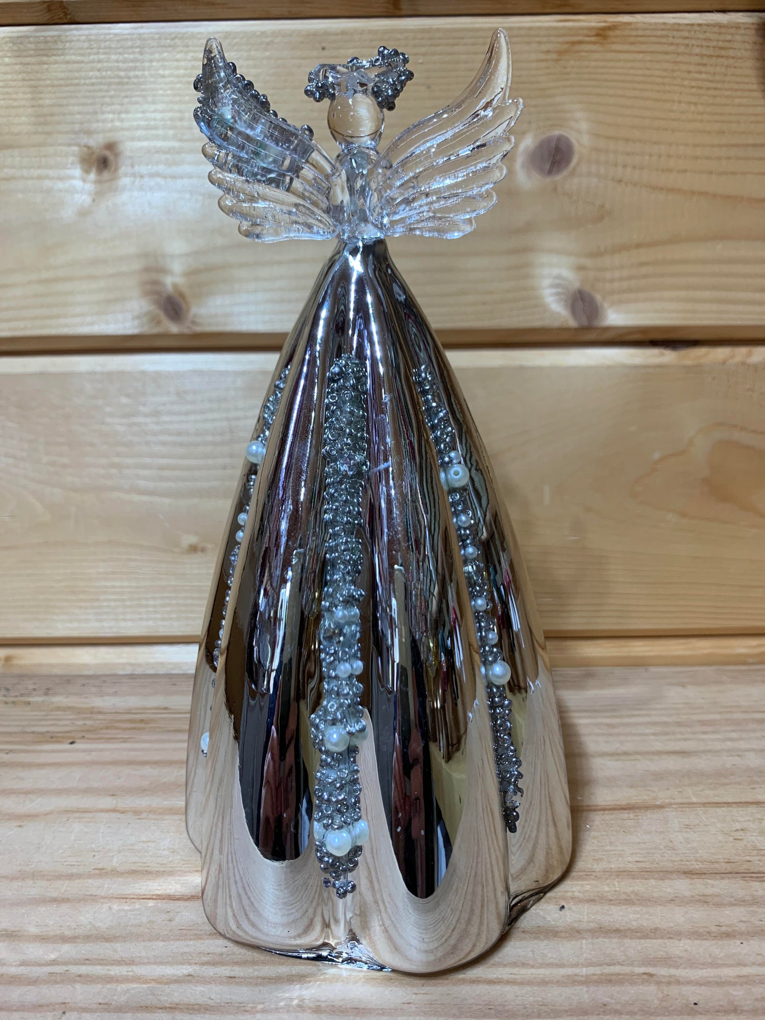 This stunning 19cm glass angel has delicate beading on the halo, wing and also on the silver mirrored skirt which is fluted.