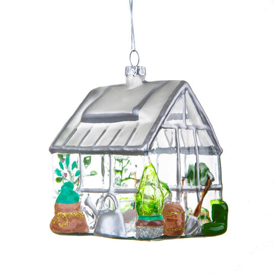 This quirky greenhouse glass Christmas decoration looks so realistic with tiny little plants and tools lying around! Perfect gift for your green fingered friends!