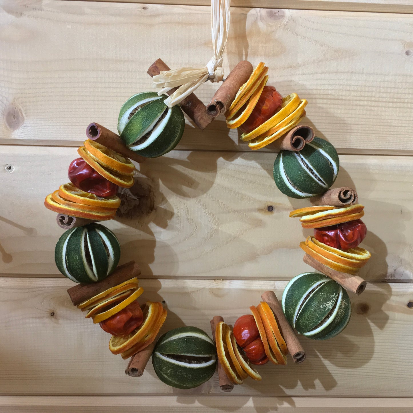 Green Limes with Cinnamon Sticks and Orange Slices Circle