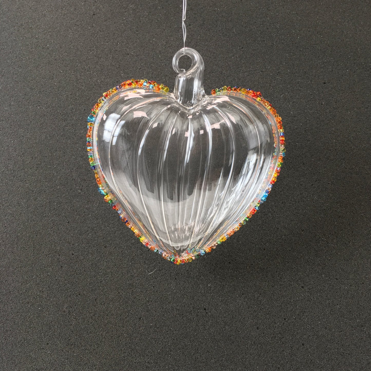Hand-blown clear glass heart decorations with multi-coloured beads for Christmas, Valentines Day and love themed decorating