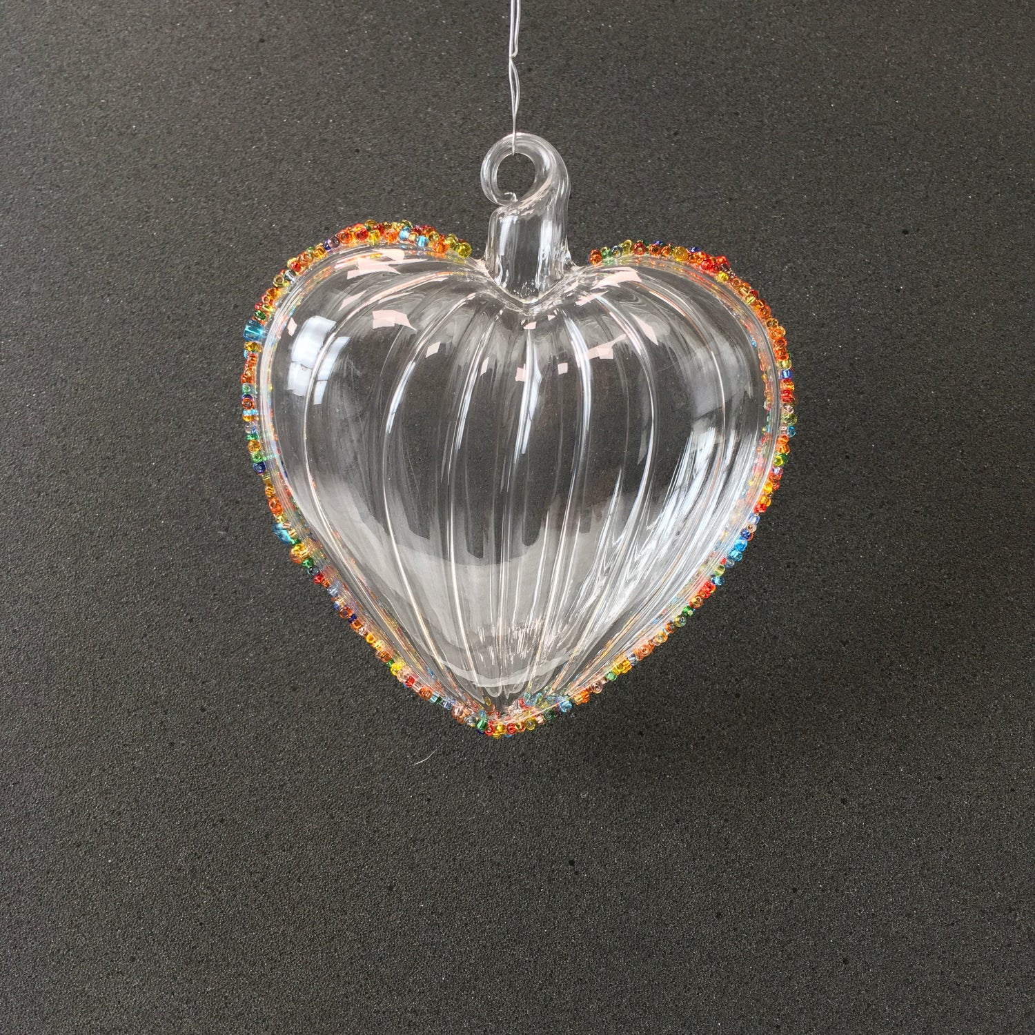 Hand-blown clear glass heart decorations with multi-coloured beads for Christmas, Valentines Day and love themed decorating