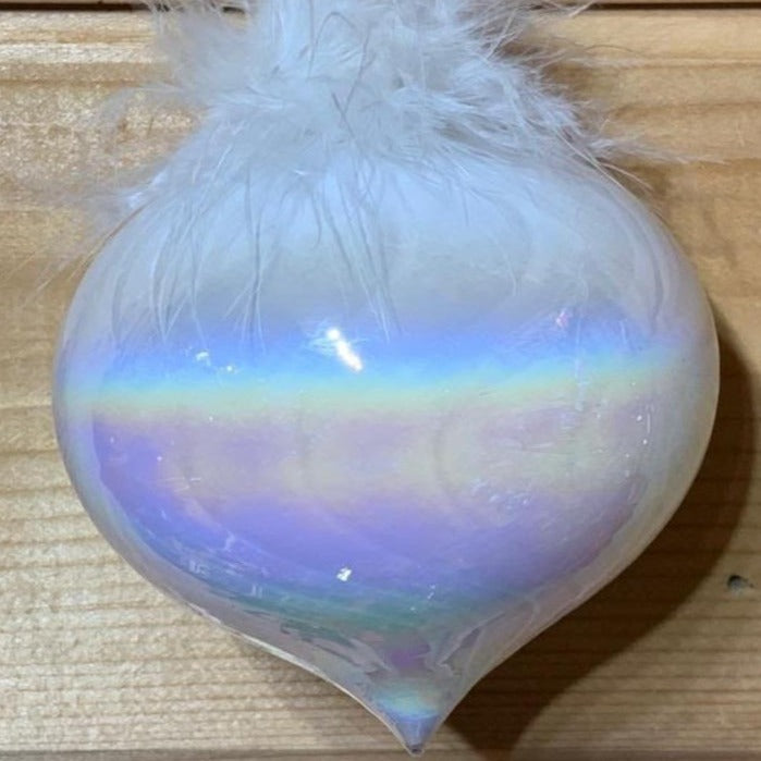 Shimmering, magical white iridescent glass Christmas tree decoration with feathers, in a sultan shape, to bring a touch of glamour to your tree.