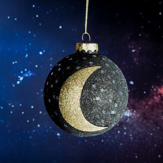 Make sure you have a Christmas that's out of this world with this very classy glass Christmas tree bauble! In a black and gold colour scheme, with glitter, this will definitely add a touch of mystery and class to your decor this festive season.