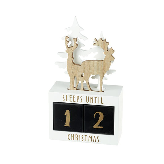 A lovely wooden Christmas countdown advent calendar featuring golden reindeer and white trees.
