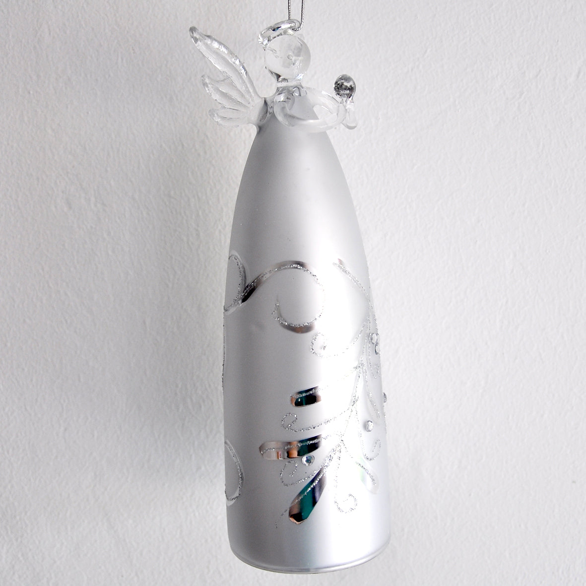 This striking silver angel is made from glass and has a classic mistletoe design on her front.