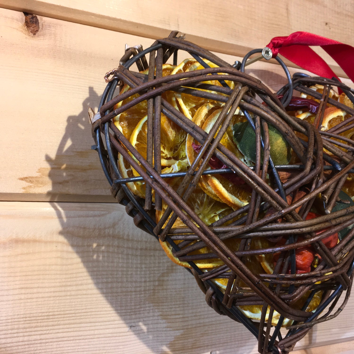 Beautiful heart shaped wicker case filled with dried fruits and scented with a wonderful Christmas fragrance.