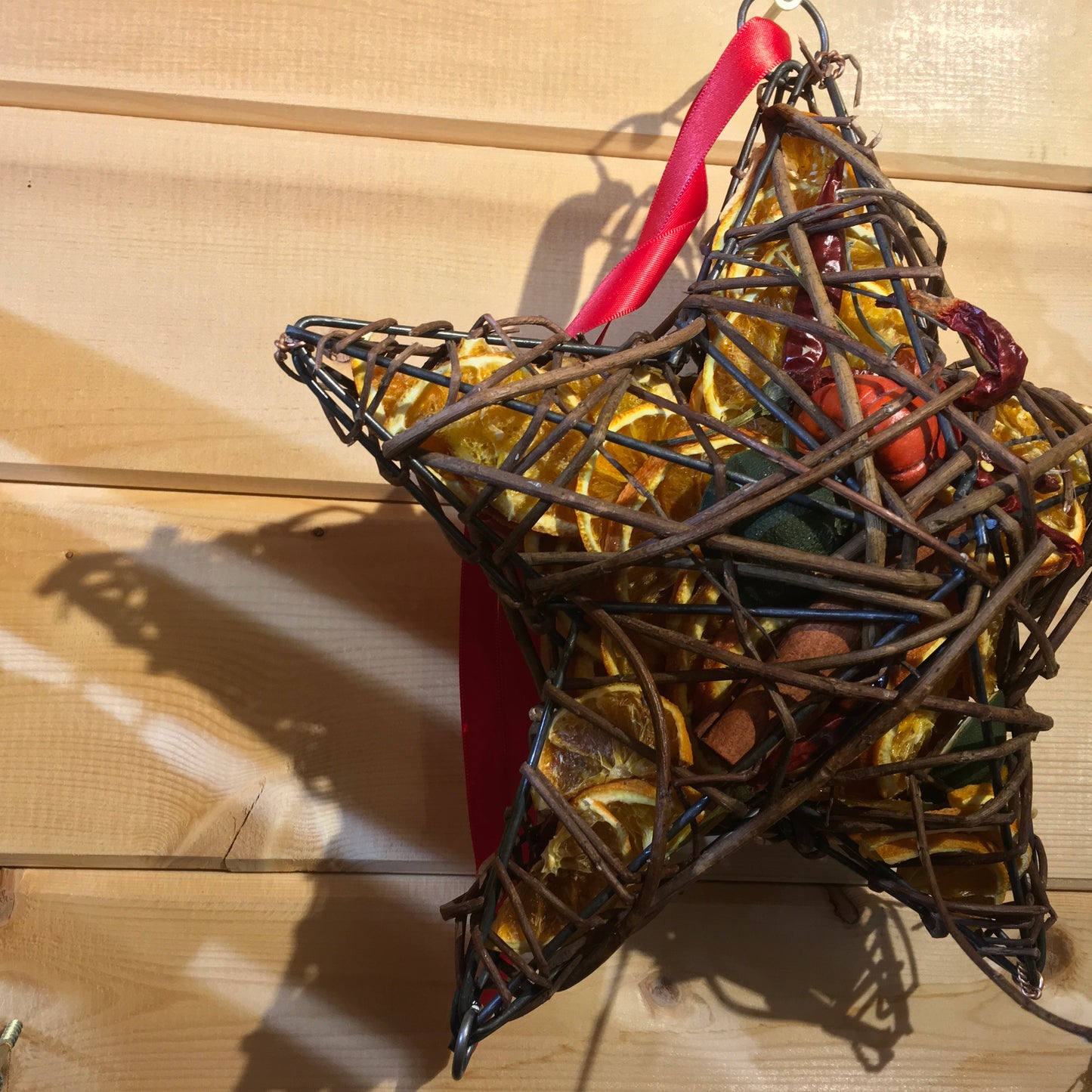 Beautiful star shaped wicker case filled with dried fruits and scented with a wonderful Christmas fragrance.