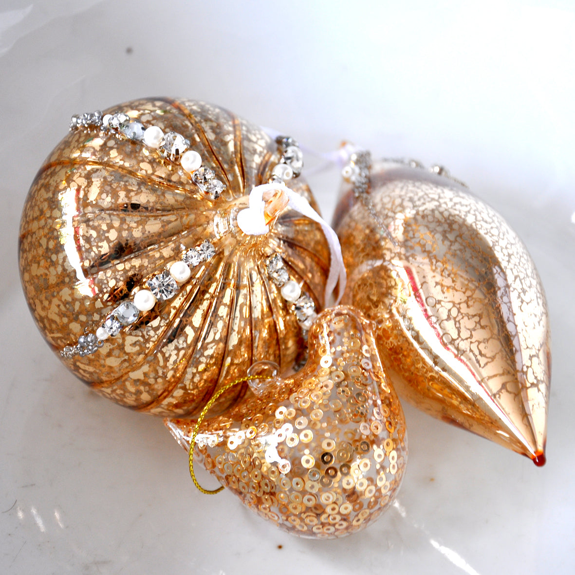 Antique gold glass handing Christmas decoration with beads, pearls and diamonte detailing.