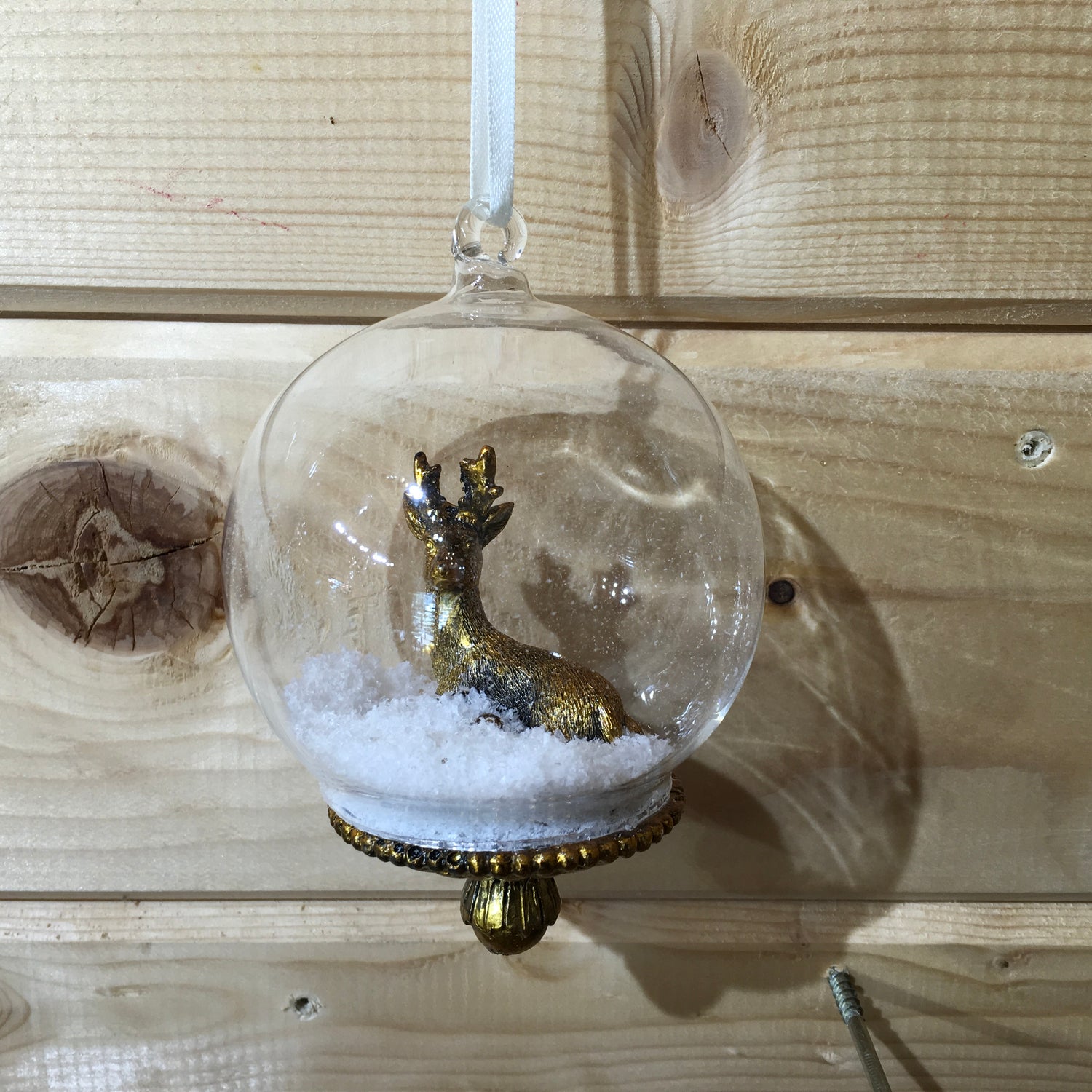 Dark gold stag deer Christmas tree decoration with snow