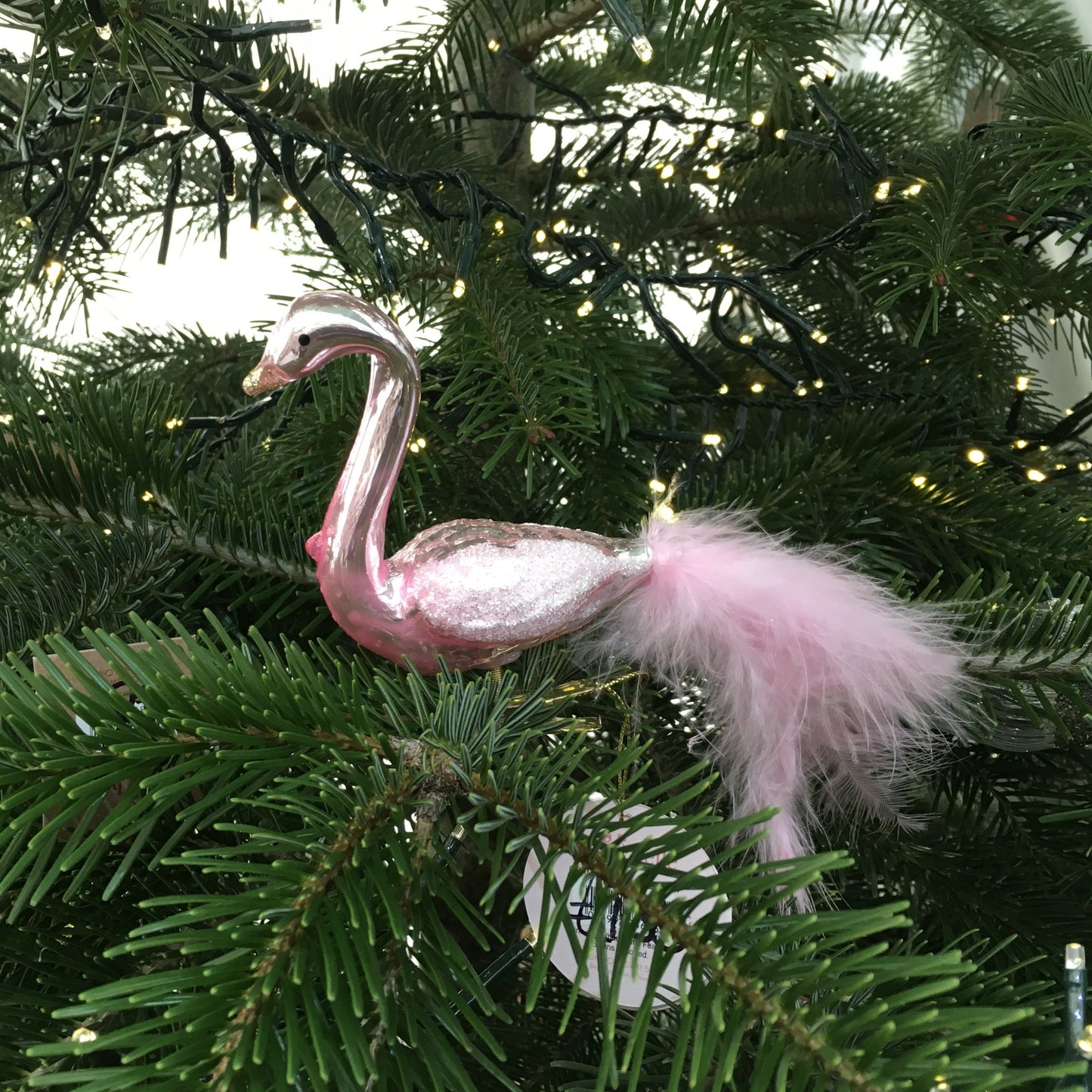 Glass Pink flamingo with gold beak, and glittery wings with real tail feathers, this clip bobs around on a tree.
