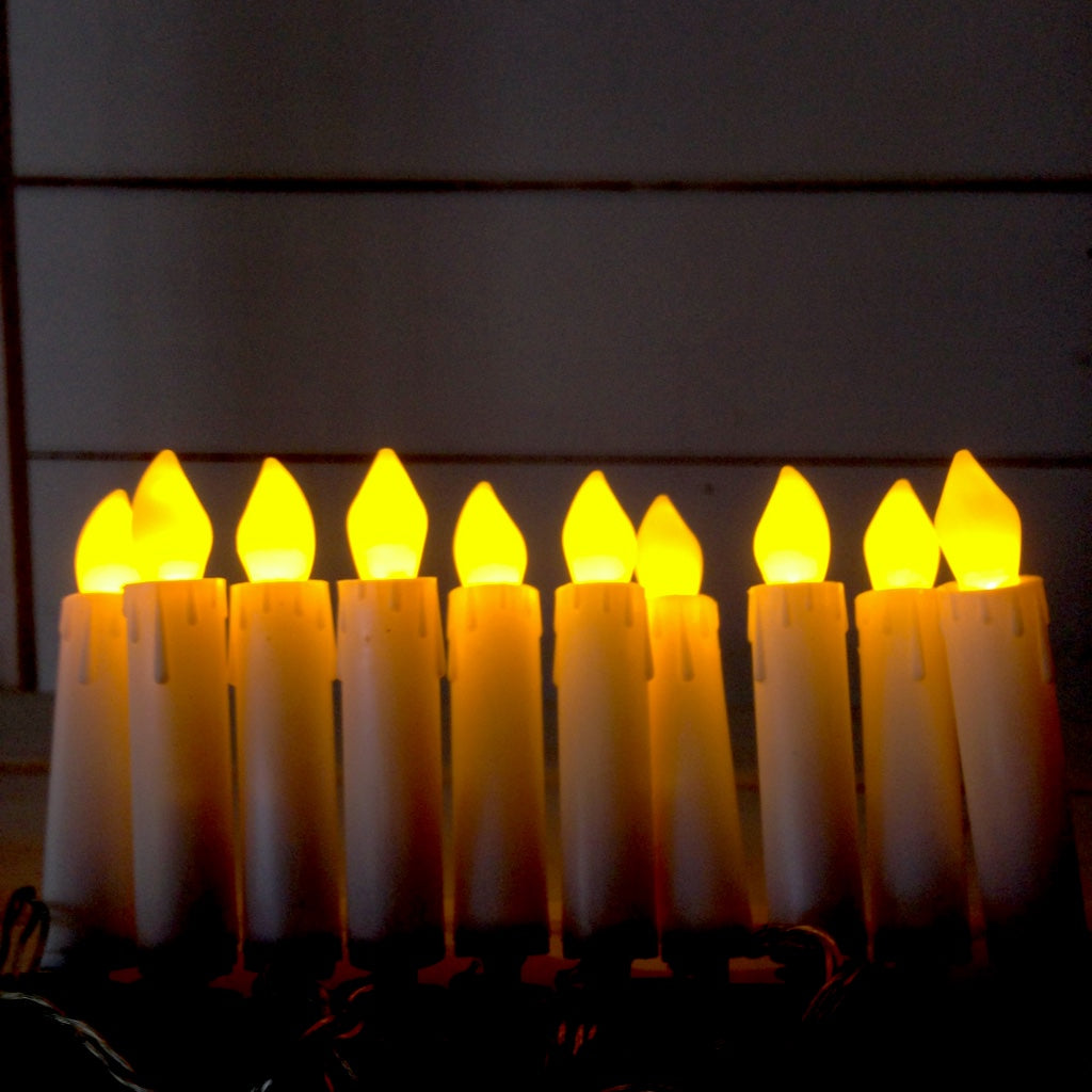 Yes this is a box of 10 flickering candle lights which clip on to your real christmas tree, battery operated.