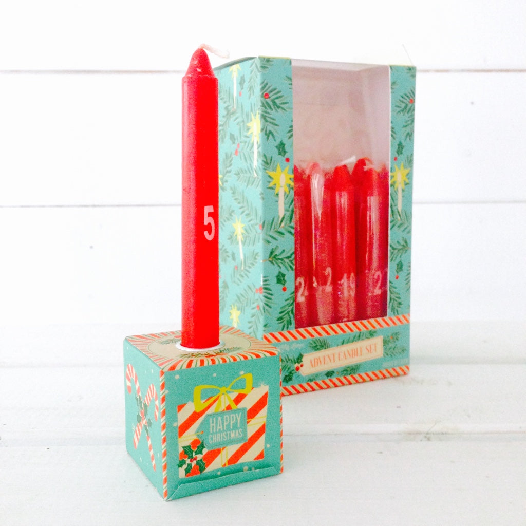 Retro red advent candle set, comes with 24 numbered candles and a stand to burn each one in.