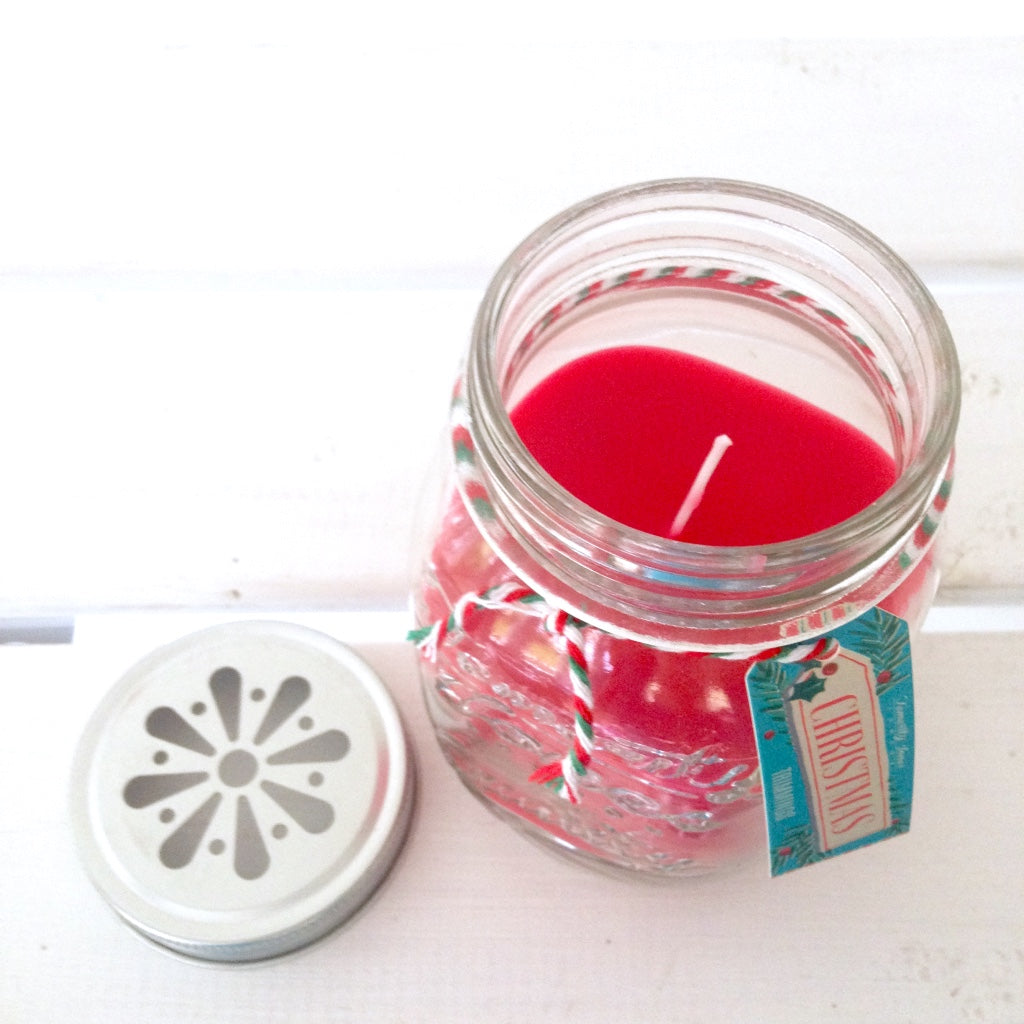 This red scented candle in a mason jar will fill the home with sweet fruity Christmas scent, perfect for adding some festive cheer and table decoration.