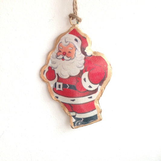 Kitsch red and white father christmas hanging tree decoration.