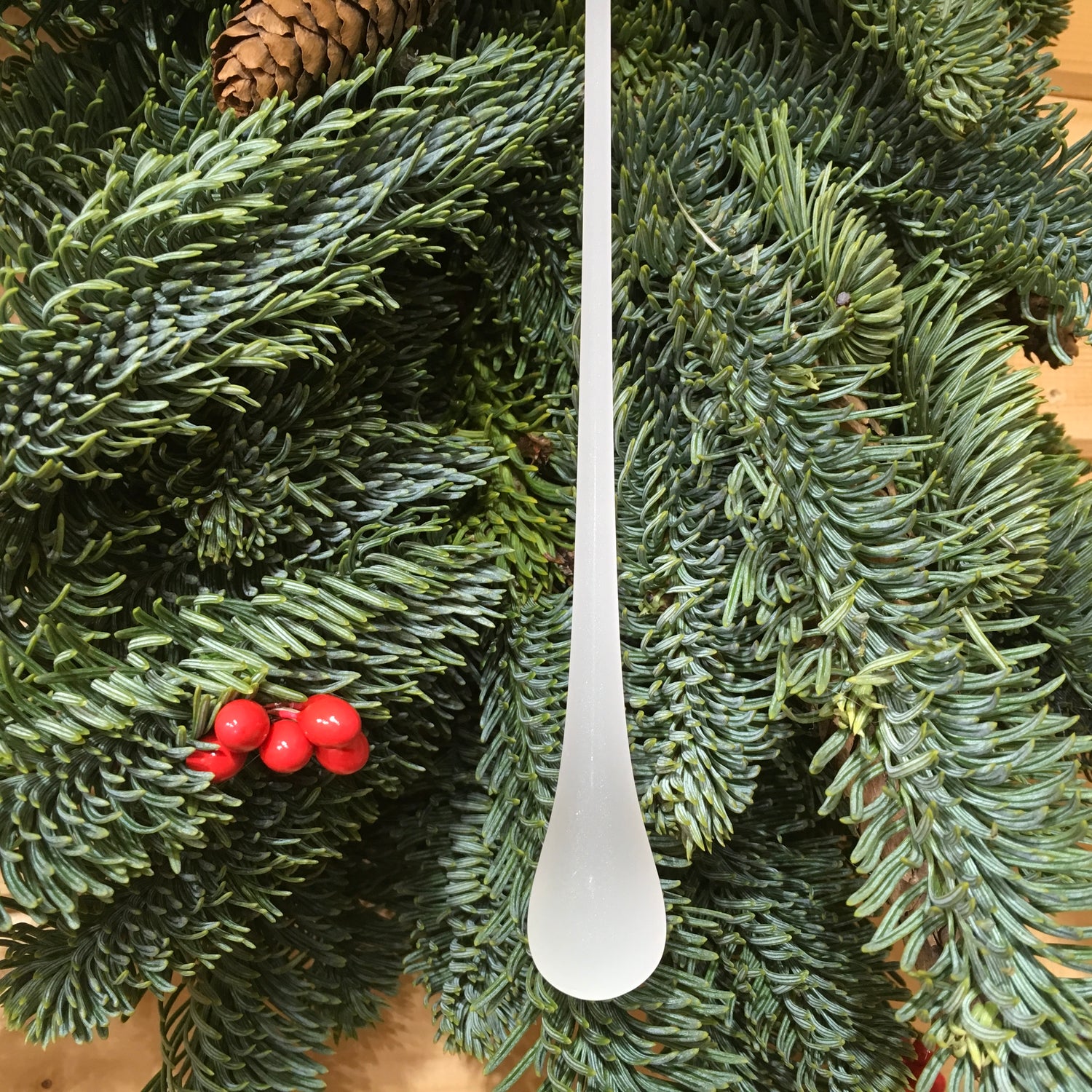 This frosted glass hanging drop is long and striking for the Christmas tree.