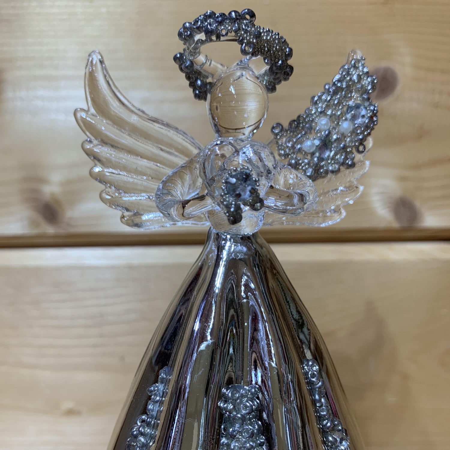 This stunning 19cm glass angel has delicate beading on the halo, wing and also on the silver mirrored skirt which is fluted.