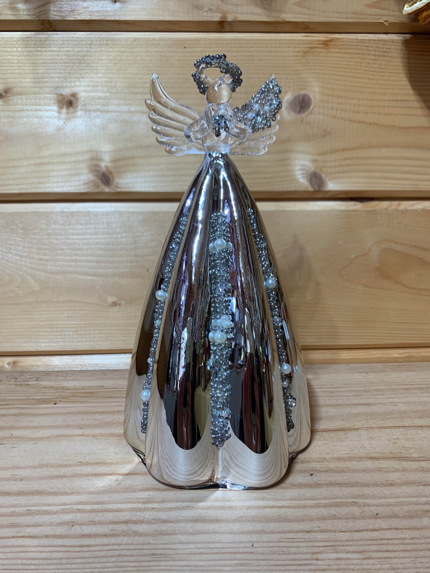This stunning 19cm glass angel has delicate beading on the halo, wing and also on the silver mirrored skirt which is fluted.