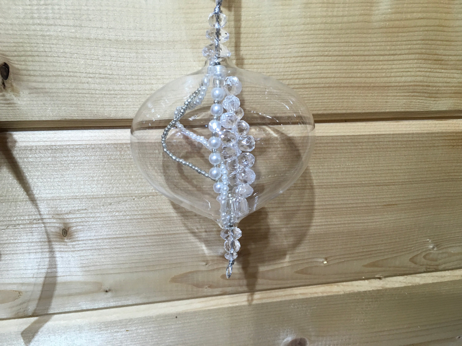 This clear glass sultan decoration is filled with strings of clear, silver and pearl beads to sparkle on a Christmas tree.