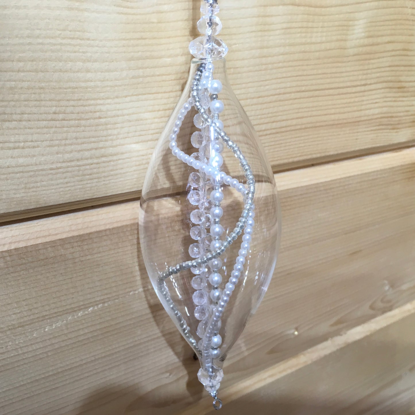 This charming glass finial is filled with strings of pearl, clear and silver beads which twinkle in the light.