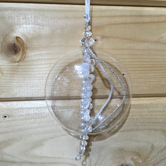 This flat sphere glass decoration is full of strings of clear, pearl and silver beads which sparkle on the Christmas tree
