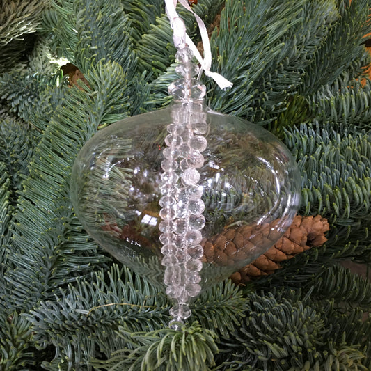 Clear glass sultan decoration with strings of clear glass beads inside which twinkle on the Christmas tree.