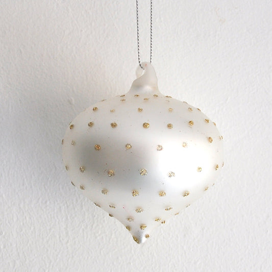 White silver glass handing Christmas decoration with glittery gold polka dots.