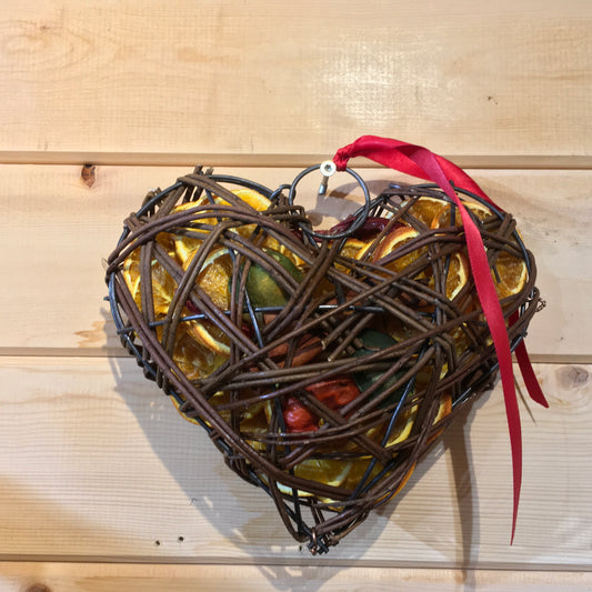 Beautiful heart shaped wicker case filled with dried fruits and scented with a wonderful Christmas fragrance.