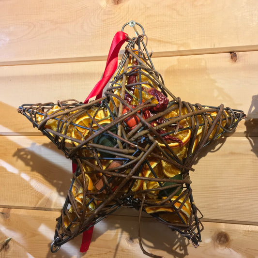 Beautiful star shaped wicker case filled with dried fruits and scented with a wonderful Christmas fragrance.