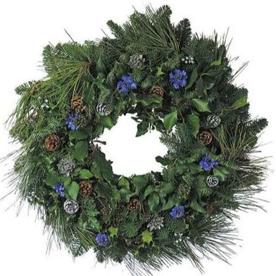 Decorated with blue cornflowers and a mixture of silver and natural fir cones.