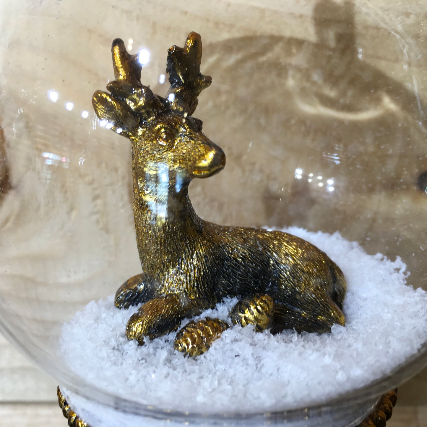 Dark gold stag deer Christmas tree decoration with snow
