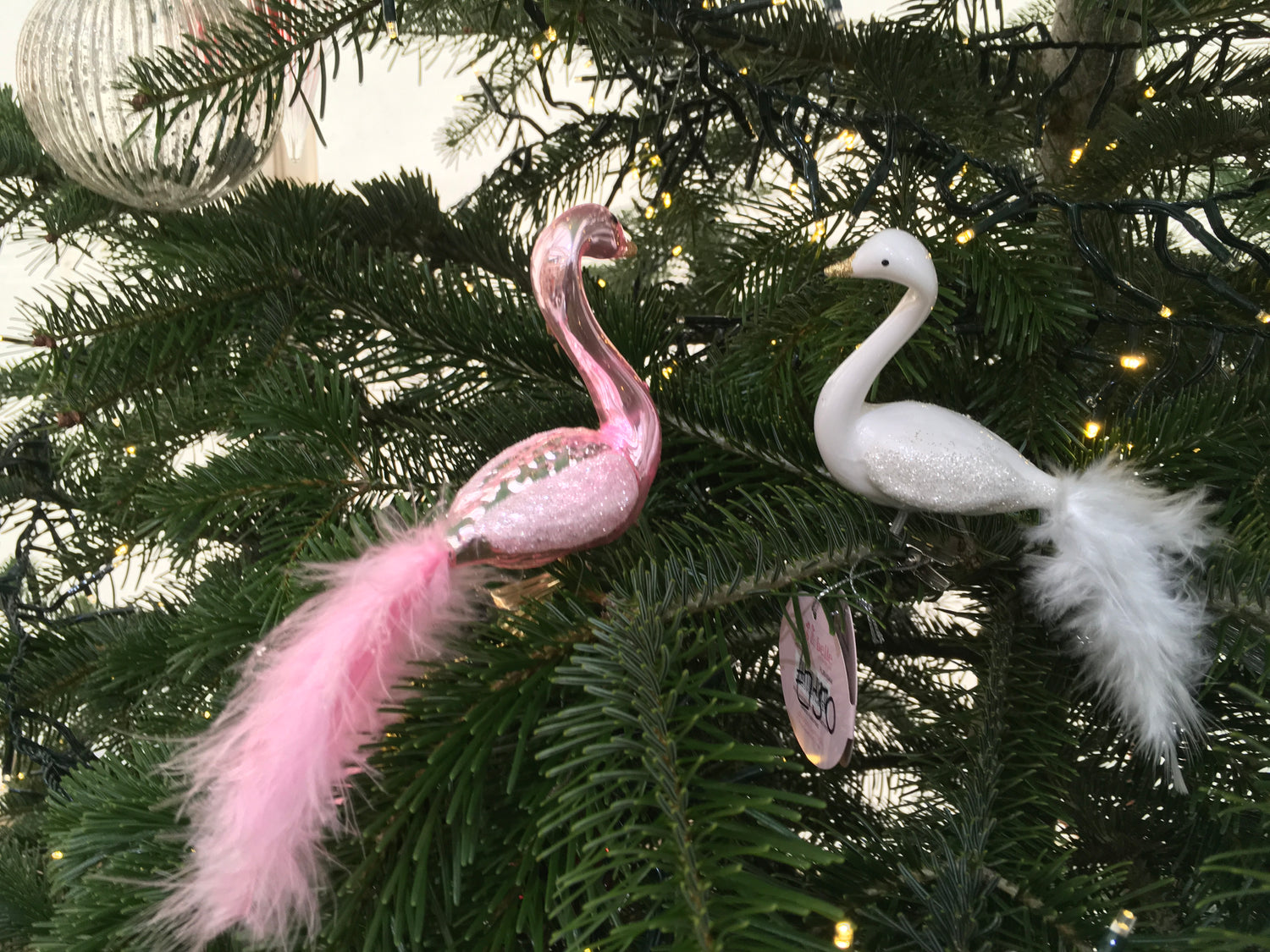 Glass Pink flamingo with gold beak, and glittery wings with real tail feathers, this clip bobs around on a tree.