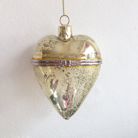 Hanging heart shaped glass ornament for Christmas Tree decoration available in gold silver and red. Opens up to hide a small gift inside.