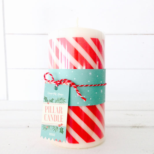 Red and white candy cane stripe pillar candle, to create a festive red and white Christmas theme to your table and home.