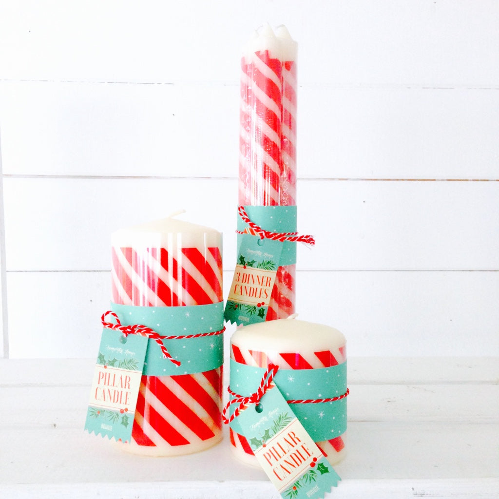 Red and white candy cane stripe pillar candle, to create a festive red and white Christmas theme to your table and home.
